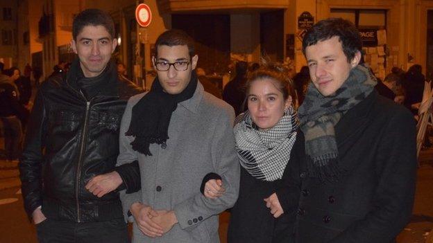 Rayan (second from left) with his friends at the vigil near the offices of Charlie Hebdo, on Rue Nicolas Appert, Paris. Photo taken 11 January, by Patrick Jackson, BBC News