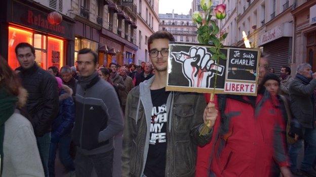 A man holds a placard at the unity rally in Paris, 11 January 2015