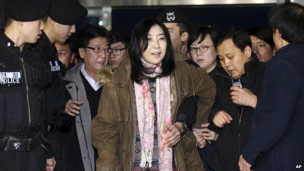 A Korean-American Shin Eun-mi, centre, arrives at the Incheon International Airport for departure in Incheon, South Korea, Saturday, 10 January 2015