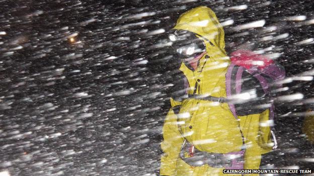 Rescuer in blizzard conditions