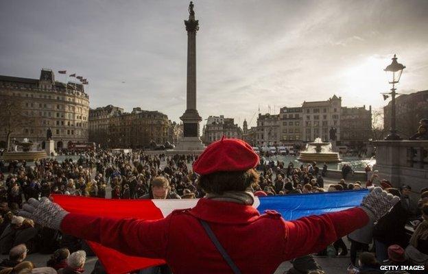 People gather in London's Trafalgar Square on Sunday 11 January to pay tribute to the victims of the terrorist attacks in Paris