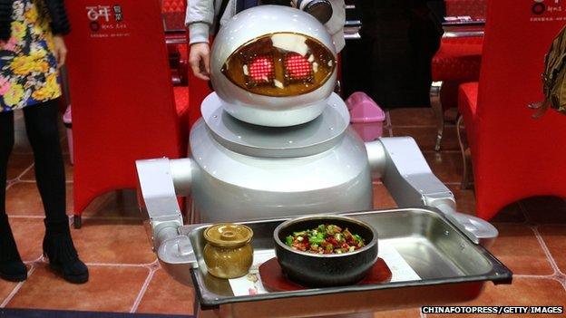 A robot waiter in a restaurant