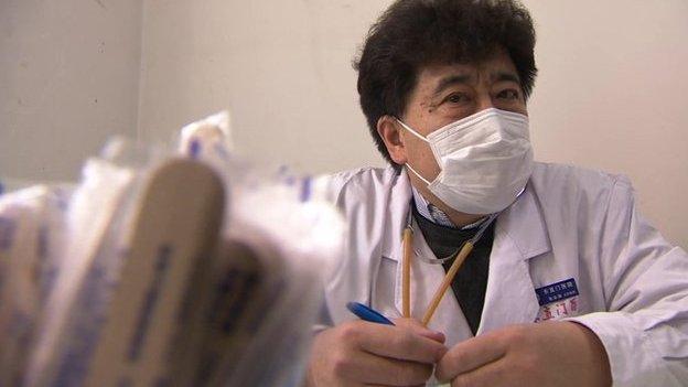 A doctor wearing a face-mask