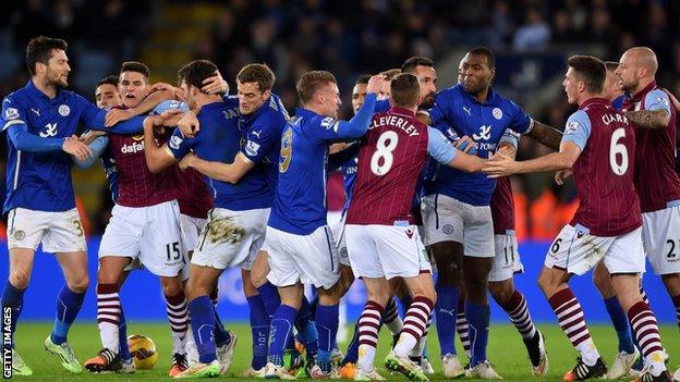 Leicester and Aston Villa players clash during the game between their sides