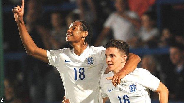 Kwame Thomas (left) celebrates scoring for England Under-20 against Romania in September