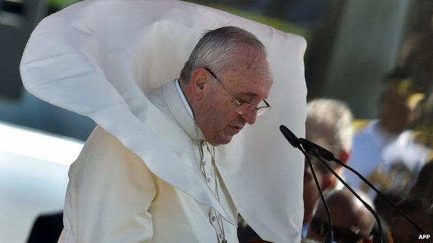 Wind blows Pope Francis" mantle as he delivers his speech at Bandaranaike International Airport in Katunayake