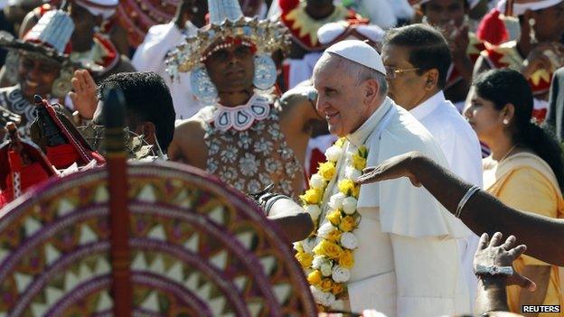 Pope Francis is greeted as he arrives at the Colombo airport January 13, 2015