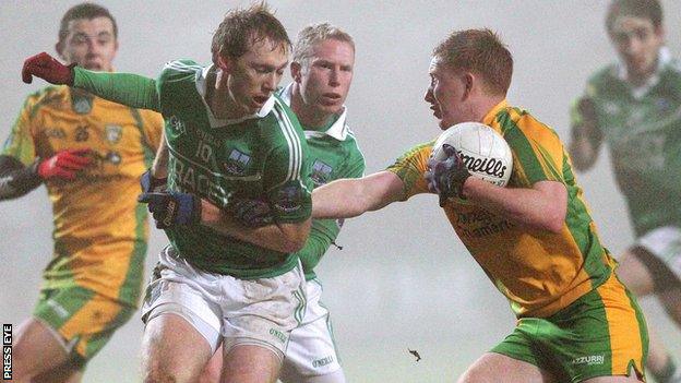 Fermanagh's Tommy McElroy blocks the path of Donegal opponent Shane McLoughln