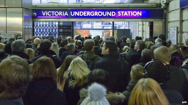 Commuters queue at Victoria Station