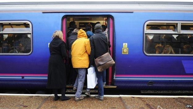 Commuters getting on a train