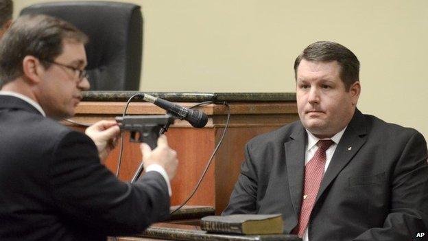 First Circuit Solicitor David Pascoe, left, shows defendant Richard Combs the weapon he used to shoot Bernard Bailey during Combs" testimony, 9 January 2015