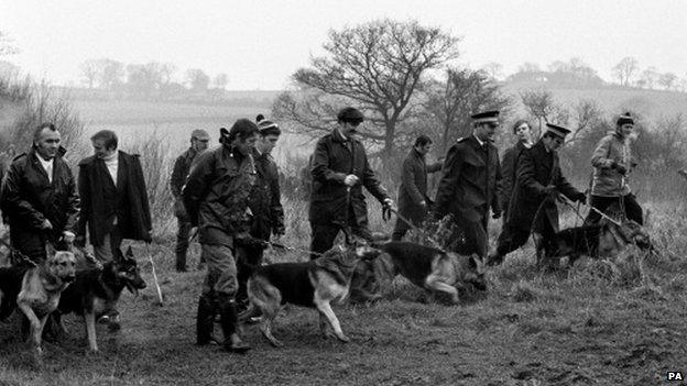 Police with tracker dogs search waste ground at Sedgley to look for clues connected with the kidnapping of Lesley Whittle