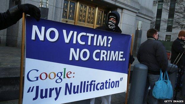 Supporters of Ross Ulbricht, the alleged creator and operator of the Silk Road underground market, stand in front of a Manhattan federal court house on the first day of jury selection for his trial on 13 January 2015