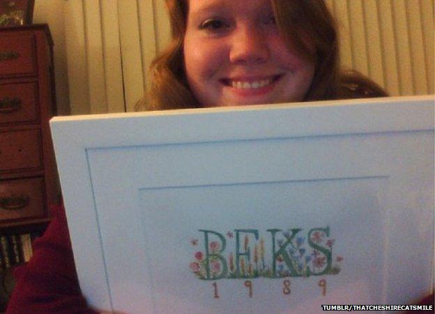 Rebekah holding the painting