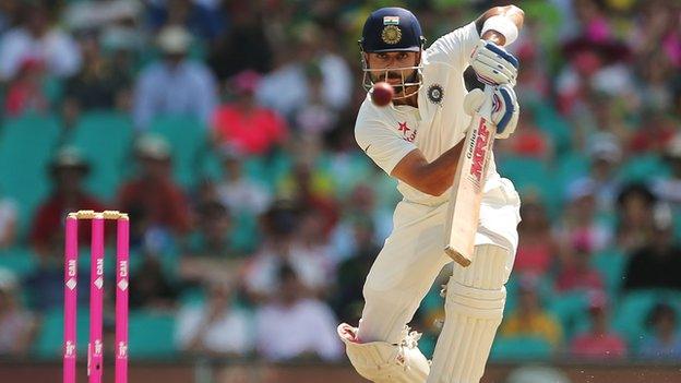 Virat Kohli plays a cover drive during day four of the Fourth Test match between Australia and India at Sydney on January 9, 2015