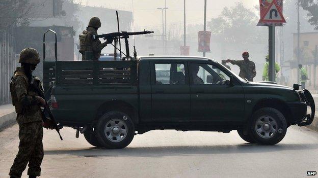 Pakistani soldiers patrol near Army Public School after it reopened in Peshawar. 12 Jan 2015