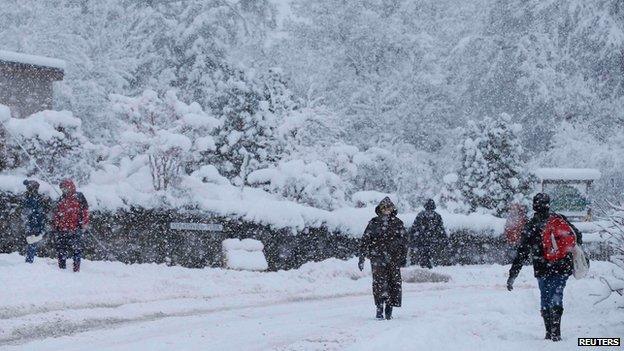 People walking in the snow in Pitlochry, Scotland