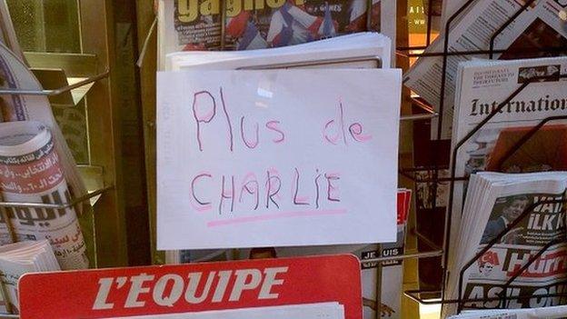 A sign at a newsstand says the latest edition of Charlie Hebdo magazine has sold out on 14 January 2015 in Paris