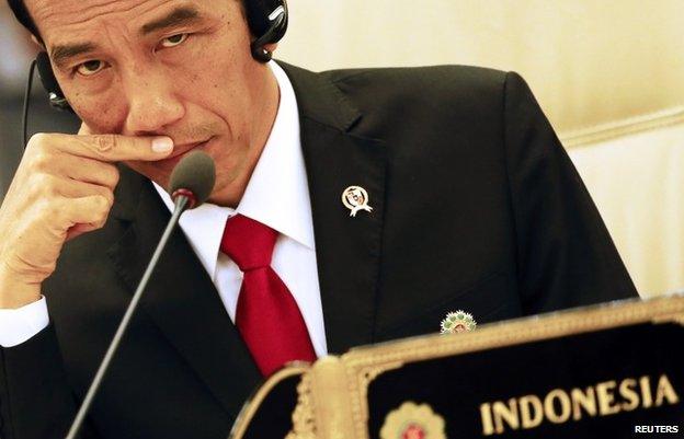 Joko Widodo listens to Japanese Prime Minister Shinzo Abe's speech at the 17th ASEAN-Japan Summit, November 12, 2014