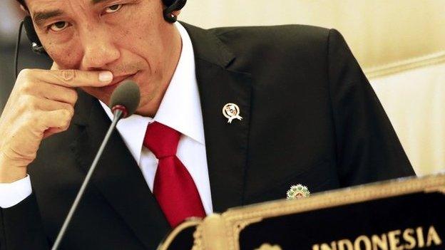 Joko Widodo listens to Japanese Prime Minister Shinzo Abe's speech at the 17th ASEAN-Japan Summit, November 12, 2014