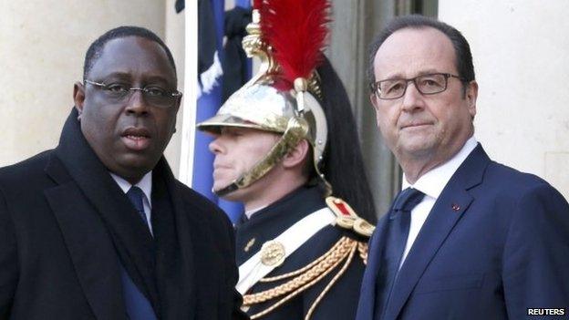 French President Francois Hollande (R) welcomes President of Senegal Macky Sall (L) at the Elysee Palace before a solidarity march in Paris on 11 January 2015