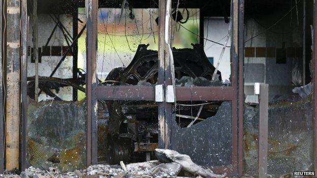 A burnt out car in the council building