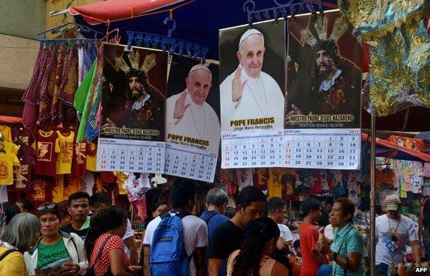 This photo taken on 6 January 2015 shows a store selling calendars with images of Pope Francis in Manila.