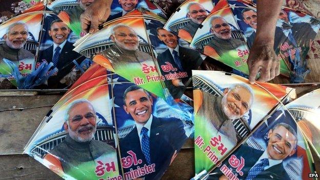 An Indian kite vendor shows kites with pictures of US President Barack Obama and Indian Prime Minister Narendra Modi on them, in a market in Bhopal, India, 10 January 2015.