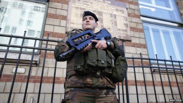 A French soldier secures the access to a Jewish school in Paris, 14 January 2015