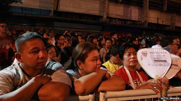 Devotees gather on President Quirino Avenue to welcome Pope Francis on his arrival to Manila city