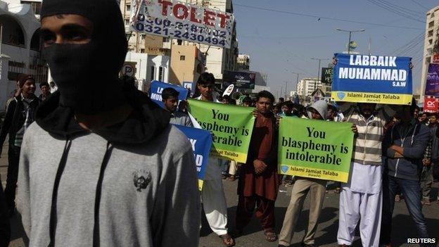 Protesters hold signs and chant slogans during a protest against satirical French weekly Charlie Hebdo in Karachi January 16