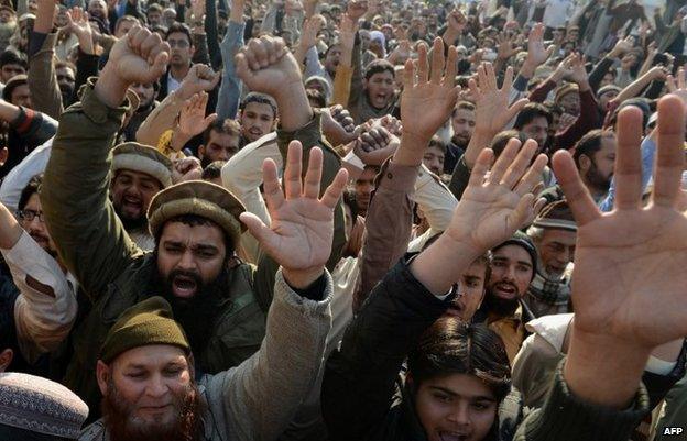 Pakistani protesters shout slogans against the printing of satirical sketches of the Prophet Muhammad by French magazine Charlie Hebdo during a demonstration in Lahore on January 16