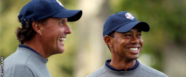 Tiger Woods and Phil Mickelson of the USA share a joke during the second preview day of The 39th Ryder Cup at Medinah Country Golf Club on September 25, 2012 in Medinah.