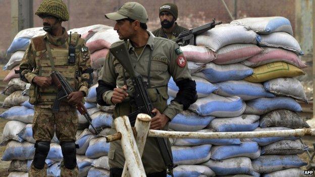 Pakistani troops keep watch near the Kot Lakhpat Jail on the outskirts of Lahore on 8 January 2015.