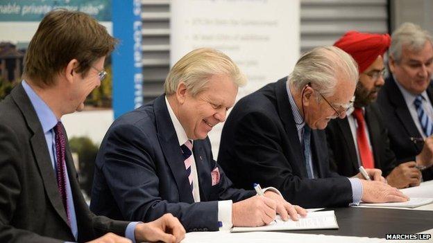 Government minister Greg Clark (left) signed the deal at Harper Adams University