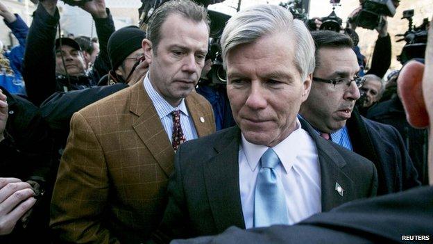 Former Virginia Governor Robert McDonnell is surrounded by members of the media after his sentencing hearing in Richmond, Virginia