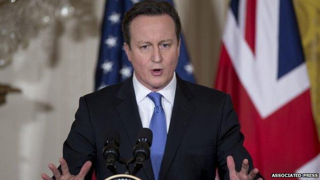 British Prime Minister David Cameron speaks during a joint news conference with President Barack Obama