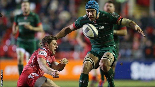 Rhys Priestland moves the ball away under pressure