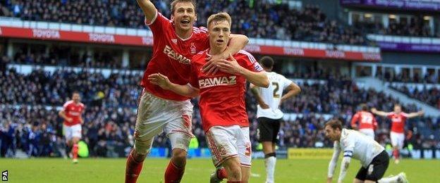 Ben Osborn (right) celebrates his late winner against Derby at the iPro Stadium