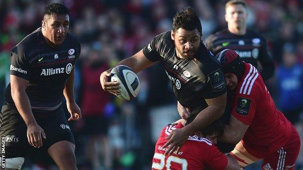 Mako Vunipola (left) looks on as younger brother Billy takes on Munster single-handedly