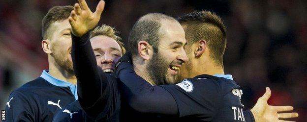 Gary Harkins celebrates scoring Dundee's third goal