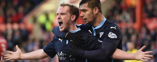 Gary Irvine (left) celebrates his equaliser for Dundee