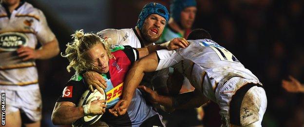 Harlequins centre Matt Hooper is tackled by James Haskell and Alapati Leuia of Wasps