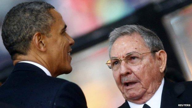 Obama and Castro at Mandela's funeral, 10 December 2013