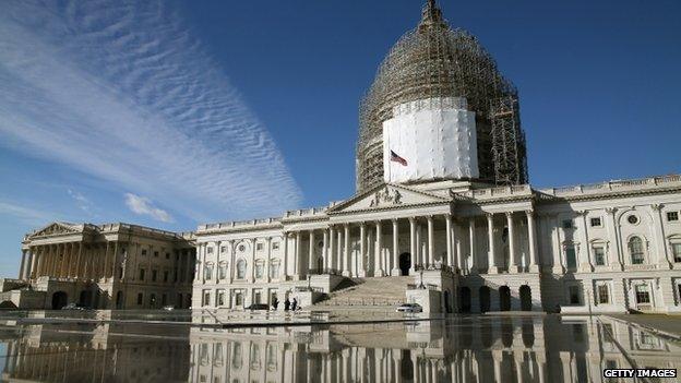 The US Capitol is reflected in a fountain, January 5, 2015 in Washington, DC.