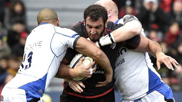 Toulouse second row Yoann Maestri is tackled by Bath centre Jonathan Joseph and flanker Matt Garvey