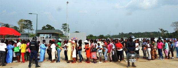 Fans queue outside the stadium