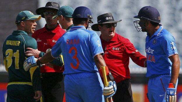 Australia batsman David Warner (left) got into a heated exchange with India batsman Rohit Sharma (right)