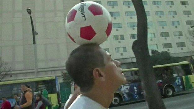 Man in Mexico balancing a football on his head for 57 days.