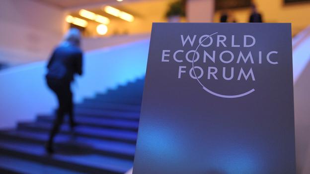 Sign reads "World Economic Forum"